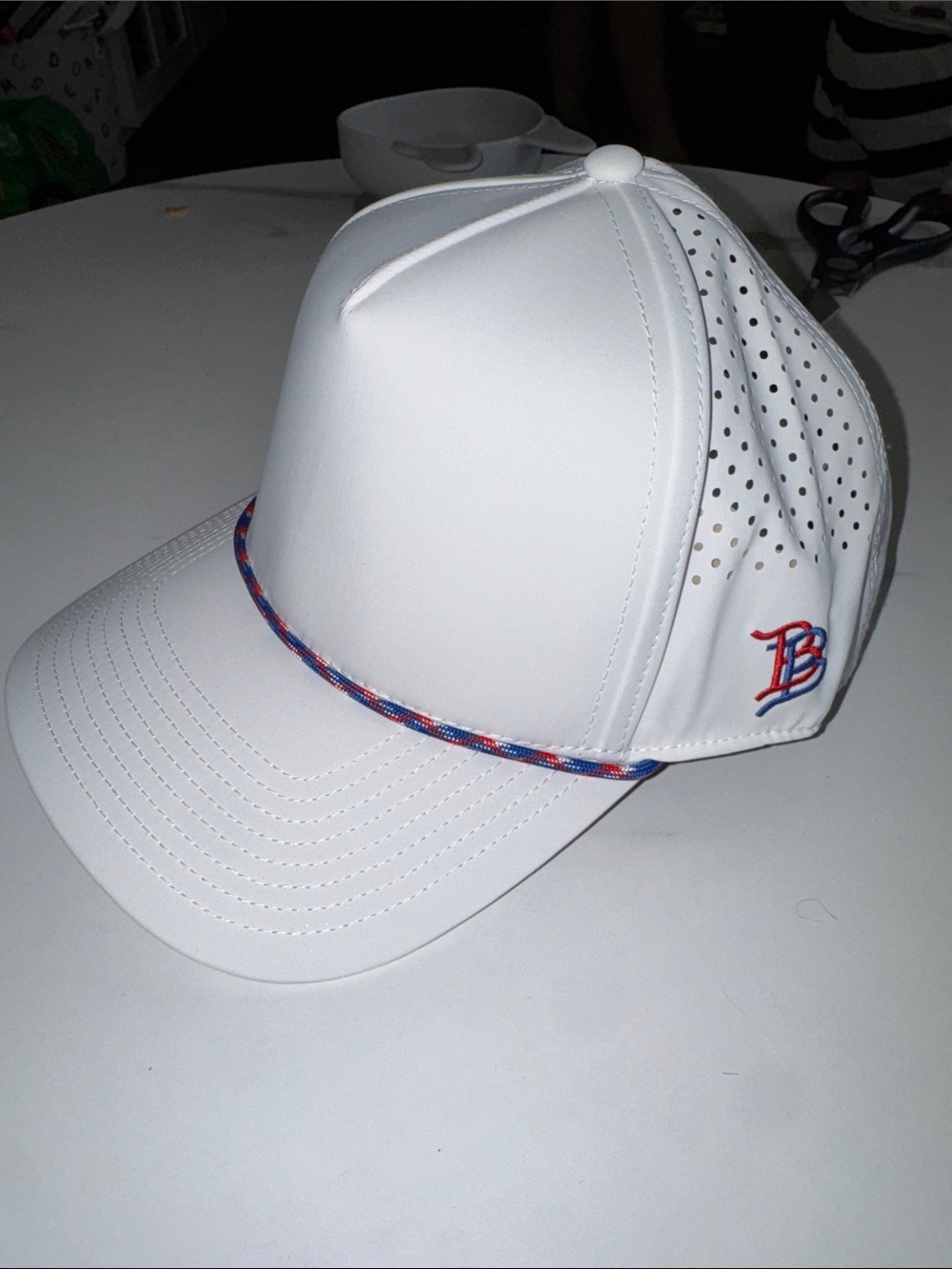 White Performance Baseball Cap with Red & Blue Logo